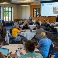 full room photo at a professional learning, seated indoors